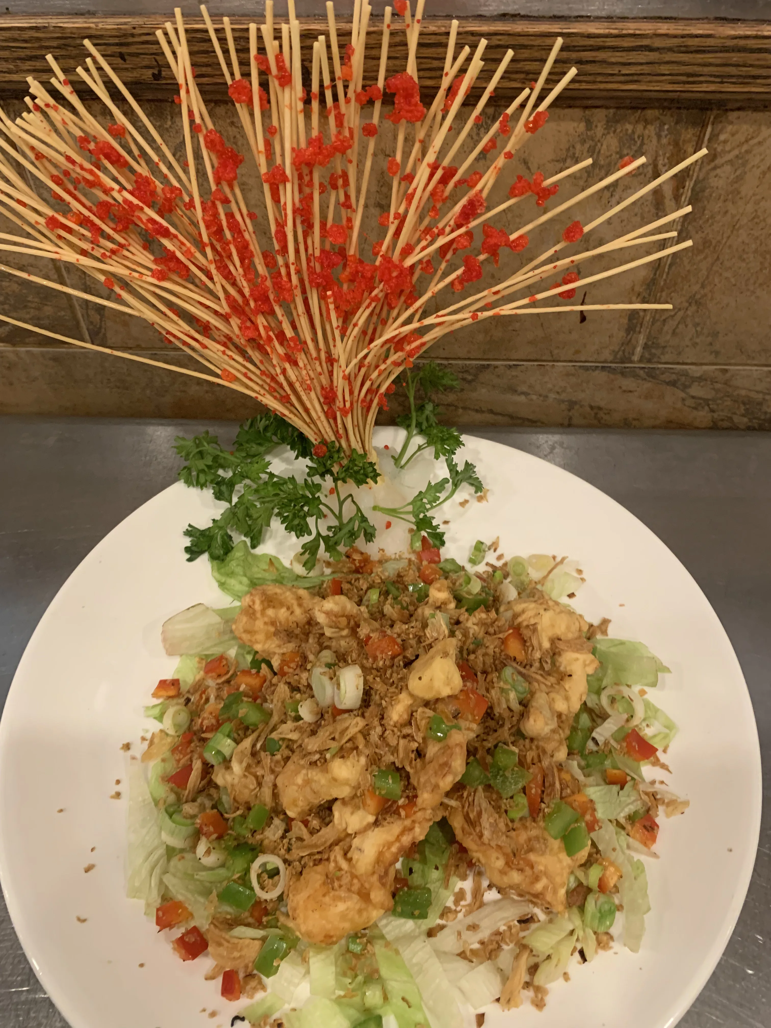 Mala spiced dish with skewer garnish