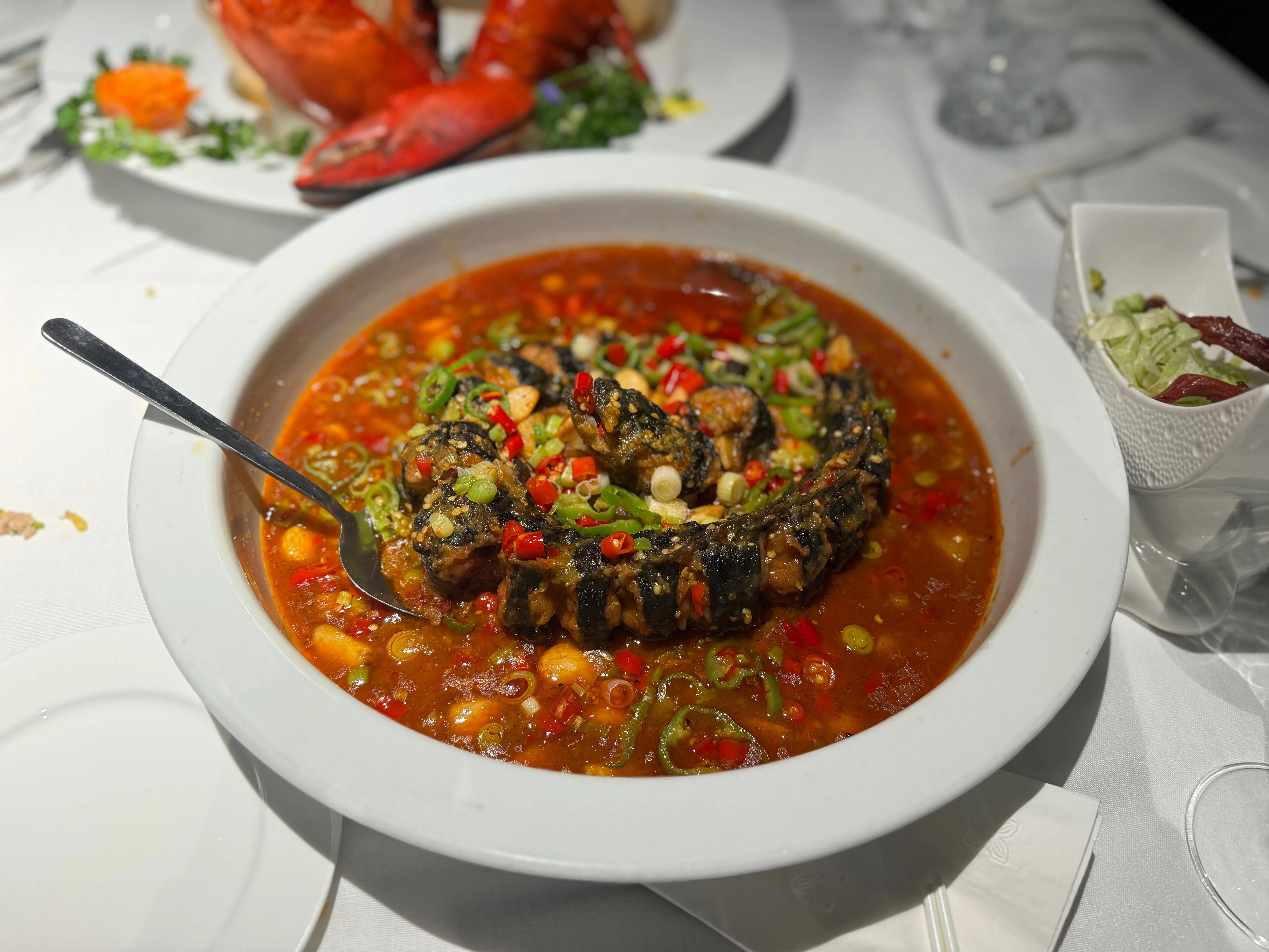 Seafood dish with carved vegetable phoenix