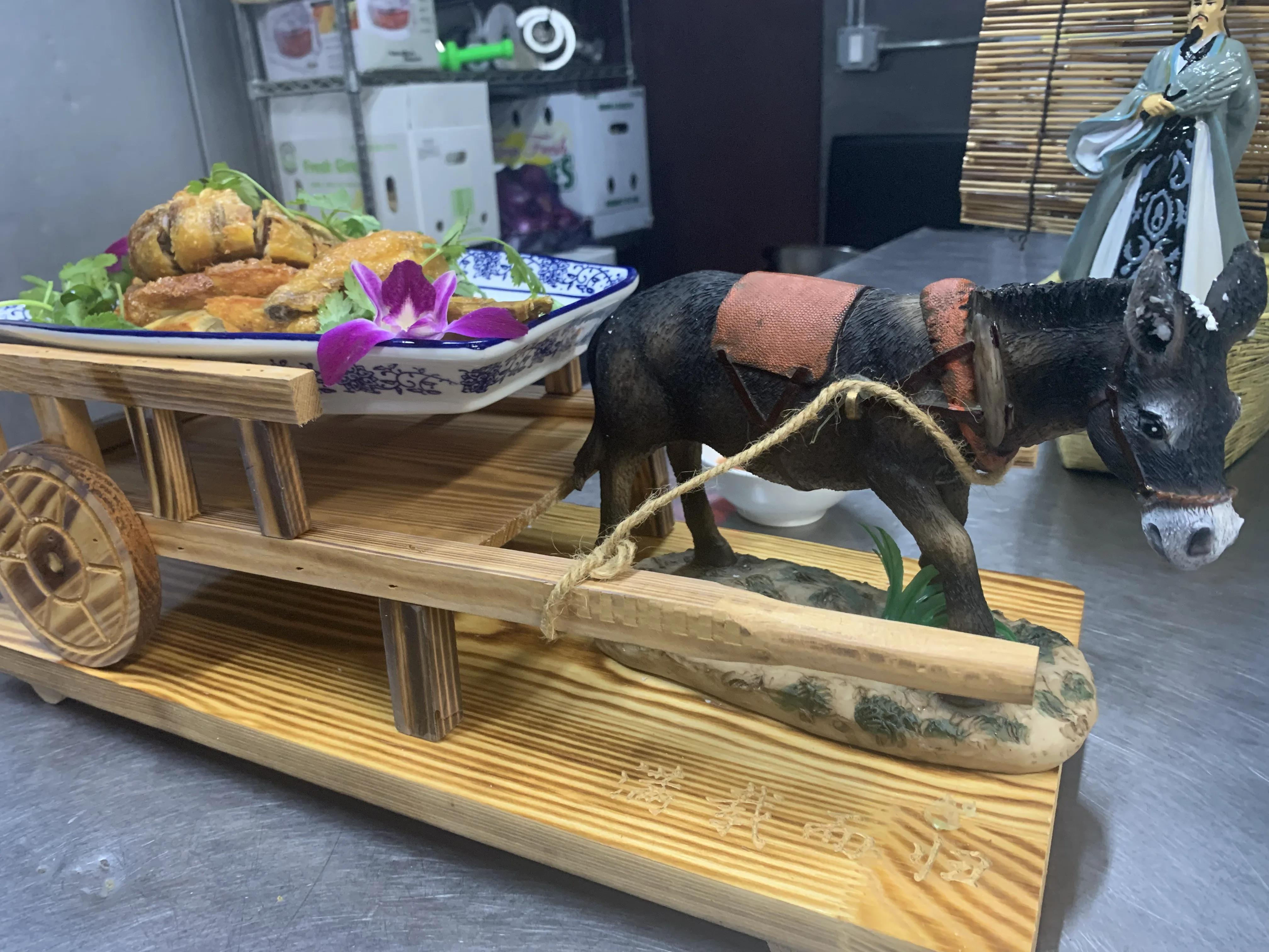 Fried appetizer platter on a carved donkey cart display