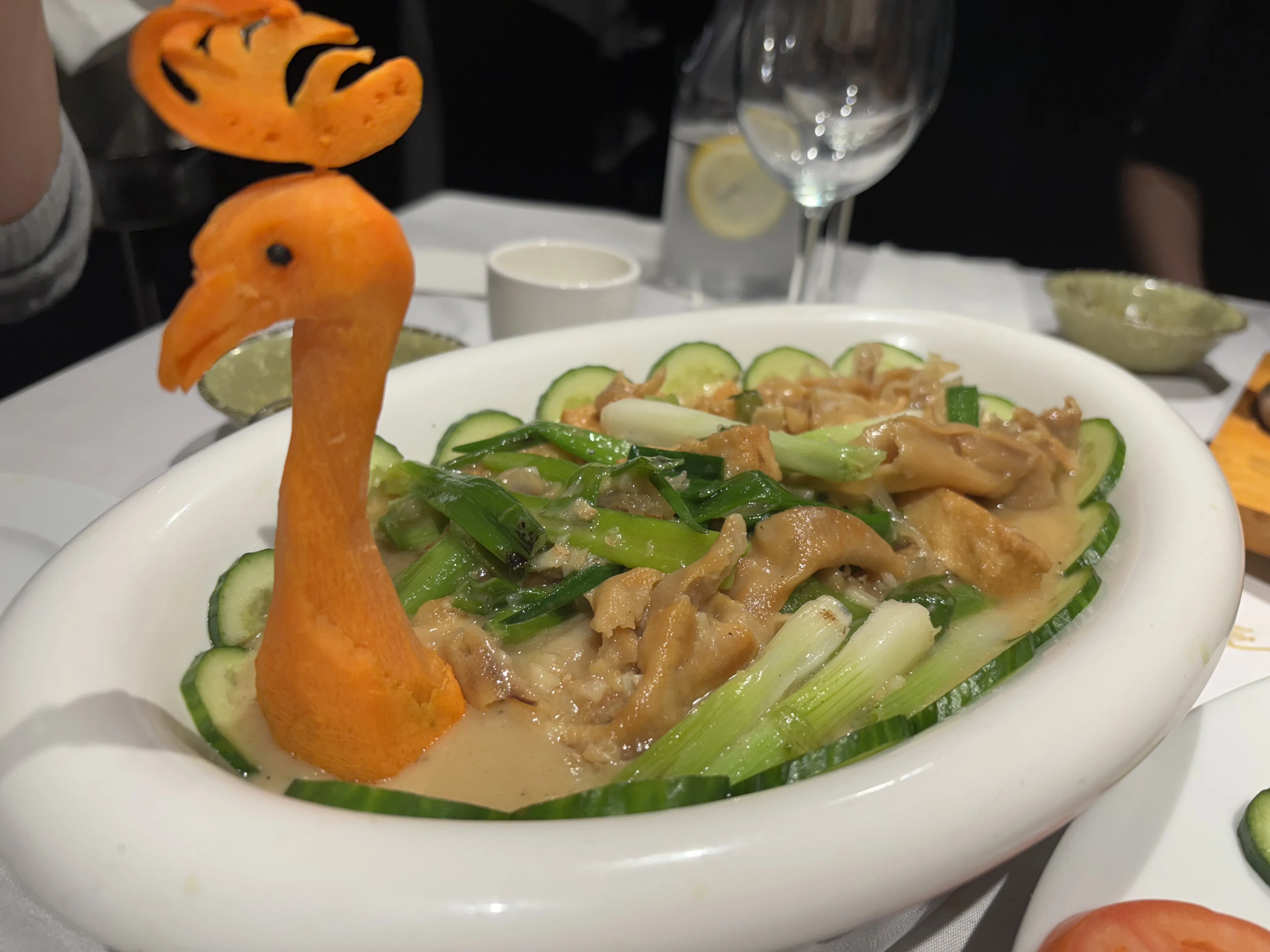 Whole fried fish plated with garnish
