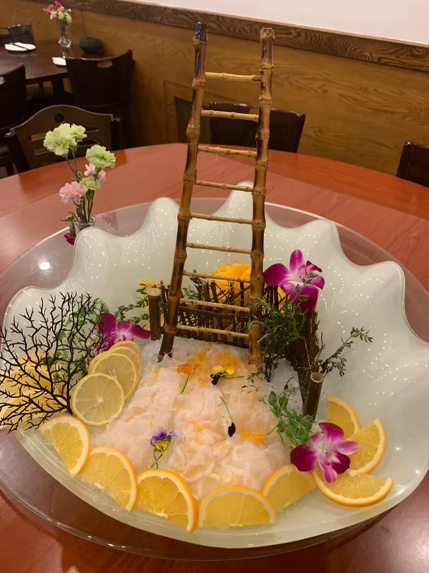 Chilled seafood presented on ice with bamboo ladder décor
